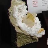 Baryte and Calcite and Dolomite on QuartzState Route 37 road cuts, Harrodsburg, Clear Creek Township, Monroe County, Indiana, USAExample is  22 cm.   The baryte is 3.8 cm.     The surrounding calcites are over  5 cm. (Author: Bob Harman)