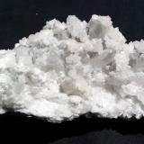 Calcite on Quartz variety smoky<br />Baimashan tunnel (construction site), Qianbaxia, Wuyishan, Nanping Prefecture, Fujian Province, China<br />11 x 6 cm<br /> (Author: Volkmar Stingl)