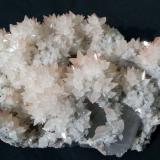 Calcite on Quartz (variety smoky)<br />Daye mining area, Edong, Daye, Huangshi Prefecture, Hubei Province, China<br />16 x 10 cm<br /> (Author: Volkmar Stingl)