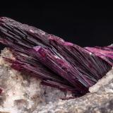 Erythrite with QuartzSchneeberg District, Erzgebirgskreis, Saxony/Sachsen, GermanySpecimen size: 9.2 × 5.7 × 5.3 cm / main crystal size: 3 × 1.2 cm (Author: Jordi Fabre)