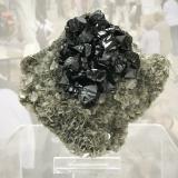 Cassiterite on Muscovite<br />Mount Xuebaoding, Pingwu, Mianyang Prefecture, Sichuan Province, China<br />Specimen size: 8.7 x 8.33.5 cm / main crystal size: 2 x 1.3 cm<br /> (Author: Jordi Fabre)