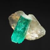 Emerald, Calcite<br />Peñas Blancas Mine, Municipio San Pablo de Borbur, Western Emerald Belt, Boyacá Department, Colombia<br />11 x 15 x 9 mm (HxWxD)<br /> (Author: Bergur_E_Sigurdarson)