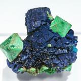 Malachite after Cuprite on Azurite<br />Chessy-les-Mines, Les Bois d'Oingt, Villefranche-sur-Saône, Rhône, Auvergne-Rhône-Alpes, France<br />3.1 × 3 × 1.6 cm<br /> (Author: Jordi Fabre)