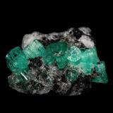 Beryl (variety emerald), Calcite<br />Coscuez mining district, Municipio San Pablo de Borbur, Western Emerald Belt, Boyacá Department, Colombia<br />28 x 24 x 11 mm<br /> (Author: Bergur_E_Sigurdarson)