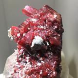 Realgar on Calcite<br />Jiepaiyu Mine (Shimen Mine), Shimen County, Changde Prefecture, Hunan, China<br />4 cm crystal<br /> (Author: Jean Suffert)