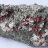 Cinnabar, Calcite<br />Le Solforate Mine, Amiata Mountain, Piancastagnaio, Siena Province, Tuscany, Italy<br />4 x 2,5 cm<br /> (Author: Volkmar Stingl)