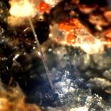 Sanidina<br />Cantera Le Novelle, Ercolano, Monte Somma, Complesso Somma-Vesuvio, Ciudad metropolitana de Nápoles, Campania, Italia<br />< 1 mm<br /> (Autor: José Luis Zamora)