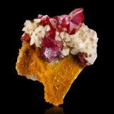 Cinnabar<br />Tongren Prefecture, Guizhou Province, China<br />10 x 6.5 x 11.5 cm / main crystal: 3.5 cm<br /> (Author: MIM Museum)