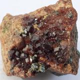 Grossular Garnet (variety Hessonite), ClinochloreRocca della Marasca, Urbe, Provincia Savona, Liguria, Italia3 x 3 cm (Author: Volkmar Stingl)