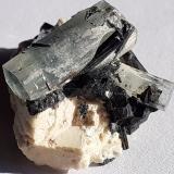 Beryl (variety aquamarine), Tourmaline (variety Schorl), Orthoclase<br />Ameib Farm 60 (Ameib Farm), Usakos, Karibib District, Erongo Region, Namibia<br />2 x 1,5 cm<br /> (Author: Volkmar Stingl)