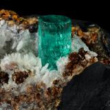 Beryl (variety emerald), Calcite, Pyrite, Goethite<br />Chivor Mining District, Camoyo Mine, Municipio Chivor, Eastern Emerald Belt, Boyacá Department, Colombia<br />77 x 65 x 42 mm, xl=14 x 8 mm<br /> (Author: Fiebre Verde)