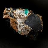 Beryl (variety emerald), Calcite, Pyrite, Goethite<br />Chivor Mining District, Camoyo Mine, Municipio Chivor, Eastern Emerald Belt, Boyacá Department, Colombia<br />77 x 65 x 42 mm, xl=14 x 8 mm<br /> (Author: Fiebre Verde)