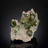 Andradite (variety demantoid)Sferlùn asbestos Mine, Vallone del Cengiaccio, Lanzada, Malenco Valley (Valmalenco), Sondrio Province, Lombardy, Italy7.5 x 6 x 4.5 cm / main crystal: 1.6 cm (Author: MIM Museum)