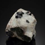 Loparite-(Ce)<br />Khibiny Massif, Kola Peninsula, Murmanskaja Oblast, Northern Region, Russia<br />3 x 2.5 x 3 cm / main crystal: 0.9 cm<br /> (Author: MIM Museum)
