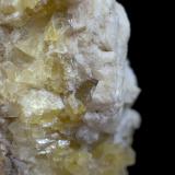 The calcite on yellow fluorite. (Author: k-m.minerals)