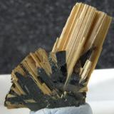 Rutile on Hematite
Novo Horizonte, Brazil 
It measures 17mm from the base to the top of the rutile, the best thing for me about this is it is under 2mm thick. (Author: nurbo)