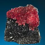 N’Chwaning mines, Kalahari Manganese fields, Northern Cape Province, South Africa, Rhodochrosite on bladed Manganite 
Size: 4.8 cm by 4.4 cm by 2.7 (Author: Gail)