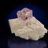 Miniature of Rose Quartz on albite, Pittorra Mine, Minas Gerais, Brazil. 5.2 cm x 3.5 cm. (Author: Jim)