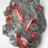 Realgar, stibnite
Baia Sprie (Felsöbánya), Maramures, Romania
106 mm x 71 mm. Main crystal: 9 mm wide, 24 mm long (Author: Carles Millan)