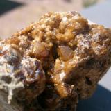 Nice golden andradite in a 4 cm shallow vug. Self-collected at Orogrande, New Mexico, USA. (Author: Darren)