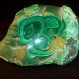 My first Malachite. I have to agree with Jordi on the sacredness of leaving a mineral in its natural form. This is not what I had ordered, the dealer was helping. Still it has the habit I am most enamored with, and kids think its pretty. It is 5" x 3 1/2 x 2" (12.7cm x 8.9cm x 5.1cm) (Author: Jim Prentiss)