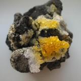 Little yellow sal ammoniac crystals on "fried" conglomerate from the Alstaden coal mine, Oberhausen, Westphalia. Here gorgeous sceleton-crystals up to 3,5 cm were found but till I will get such a killer I make do with the shown one... (Author: Andreas Gerstenberg)