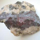 Massive pyrargyrite ("Rotgültig") in dolomite/fluorite matrix from König David mine, Annaberg district, Erzgebirge, Saxony. 6,5 cm sample. (Author: Andreas Gerstenberg)