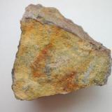 Yellow russellite on 5 cm quartz matrix from Himmelfahrt mine, Johanngeorgenstadt, Erzgebirge, Saxony. With old label. (Author: Andreas Gerstenberg)