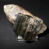 3 cm wolframite plate on smoky quarz crystal from Zinnwald, Erzgebirge, Saxony. (Author: Andreas Gerstenberg)