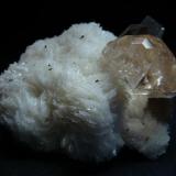 This specimen consists of a matrix of snowy white cleavelandite hosting several smoky quartz crystals (to 21mm) and a single, perfectly formed peach topaz. This prismatic topaz, with its complex pyramidal termination, measures 28mm across by 23mm tall.

Pakistan, Northern Areas, Skardu, Yunu, Shigar Valley

Size 70 x 63 x 37 mm (Author: olelukoe)
