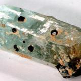 Aquamarine crystal with small schorl crystals: Erongo mountains, Namibia Size: 40 by 16 by 13mm (Author: Henk Viljoen)