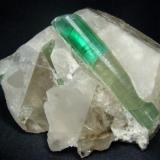 Bright-green color tourmaline crystals on quartz from Afghanistan, Paprok locality

Size 110 x 84 x 71 mm (Author: olelukoe)