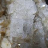 Close up showing Sulphide inclusions in 2 cm Fluorite cube. (Author: nurbo)