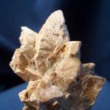 This is a busy little piece. It took nearly fifteen years to get the whole story from the Alaska Geological Survey, on this ugly little specimen. It is Calcite var. Glendonite pseudomrph after sand included Glauberite. I picked it up Near Carter Creek, North Slope, Alaska, while crewing a helicopter in 1983. It is 2 1/2" x 1 5/8" (6.35cm x 4.13cm) (Author: Jim Prentiss)