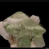 Herderite 
Shigar, Pakistan
fov 4 cm

Interessant with quartz on green cristal (Author: ploum)