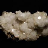 Analcime + stilbite + thomsonite, laumontite + chabazite
Moonen Bay, Isle of Skye, Scotland, UK
Specimen 16 cm x 8 cm x 8 cm
Crystals to 20 mm

Analcime crystals to 20mm on matrix with stilbite, thomsonite, laumontite and chabazite. Specimen 16cm x 8cm x 8cm; self-collected 2003 from Moonen Bay, Isle of Skye, Scotland. (Author: Mike Wood)