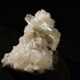 Apophyllite + thomsonite + chabazite
Moonen Bay, Isle of Skye, Scotland, UK
Apophyllite crystal 24 mm x 4 mm

Double terminated apophyllite crystal 24mm x 4mm on thomsonite and chabazite. Self-collected 1994 from Moonen Bay, Isle of Skye. (Author: Mike Wood)