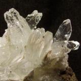 Fluorapophyllite
Moonen Bay, Isle of Skye, Scotland, UK
Crystals to 10 mm

Apophyllite crystals to 10mm; nicely transparent and with pyramidal terminations. Self-collected from Moonen Bay, Isle of Skye. (Author: Mike Wood)