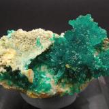 Dioptase with Wulfenite and Calcite
Mammoth-St. Anthony Mine, Tiger, Pinal County, Arizona, USA 
Mined about 1959
Former Folch Collection
Specimen size: 3.3 × 2.4 × 1.8 cm.
Calcite fluorescent long & short UV
Photo: "Reference Specimens" (Author: Jordi Fabre)