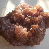 Quartz on Barite, Palm Park, Dona Ana County, NM. The matrix is bladed greenish-brown barite. 10 cm. (Author: Darren)