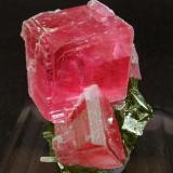 Rhodochrosite with Tetrahedrite and Quartz
Corner Pocket, Watercourse Raise, Sweet Home Mine, Alma, Colorado, USA
Mined in September 1994
Specimen size: 4 × 2.8 × 2.5 cm.
Main crystal size: 1.5 × 1.5 cm.
Photo: Reference Specimens (Author: Jordi Fabre)