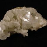 Fluorapophyllite + stilbite + quartz
Creag na Cuail, Duirinish, Isle of Skye, Scotland, UK
Specimen is 8 cm wide x 4 cm x3 cm.
The double terminated apophyllite crystal is 34 mm x 16 mm.

Apohyllite + stilbite + quartz. The double terminated apophyllite crystal is 34mm x 16mm. The specimen is 8cm wide x 4cm x3cm. Self-collected 1995 from Sgurr nam Boc, Isle of Skye. (Author: Mike Wood)