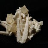 Calcite + stilbite. Same specimen as Skye Minerals 094 seen previously, from a slightly different angle. Specimen is 58mm high and 80mm wide from this angle. Self-collected 1998 from Camas na h-Uamha, Duirinish, Isle of Skye. (Author: Mike Wood)