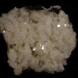 Chabazite. A nice plate of lustrous white chabazite crystals to 10mm. Specimen measures 8cm x 7cm. Self-collected 1993 from Talisker Bay, Isle of Skye, Scotland. (Author: Mike Wood)