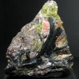 Ferropargasite, epidote,  pink calcite and almandine garnet. Manuel-Mercedes Quarry. Cala Mines. Huelva. Andalusia. Spain. 8 cm (Author: nimfiara)