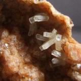 Natrolite on Gmelinite, Little Deer Park Quarry,Glenarm, Co Antrim, Northern Ireland, FOV approx 10 x 7 mm (Author: nurbo)