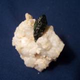 This dark green Diopside is from the Mulvaney Property, Pitcarin, Saint Lawrence County, New York and measures 5/8" x 3/16" (1.59 cm x 0.48 cm) (Author: Jim Prentiss)