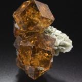 Grossular (variety Hessonite)
Belvidere Mountain Quarries (Eden Mills Quarries), Vermont, USA
Gail and Jim Spann Collection
1.3 x 1.9 x 1.1 cm.
Photo: Jeff Scovil

This State has a double honor, to be leaded by one image of the great Jeff Scovil as well as the fact that the image is of a specimen from Gail &amp; Jim Spann Collection! ;-)
 Thank you so much to Jeff, Gail and Jim. The photo and the specimen deserves to lead this State. (Author: Jordi Fabre)