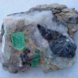 Emerald on calcite matrix
Muzo, Colombia.
Specimen size: 7 x 5 x 6 cm
Crystal size: 10 x 8 mm, 12 x 5 mm
Year: 2007 (Author: Leon56)