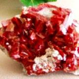 Realgar
Baia Sprie, Maramures, Romania 
Dimensions in cm: 5.5 x 4.2 x 3
Largest crystal in cm: 1 (Author: Leon56)